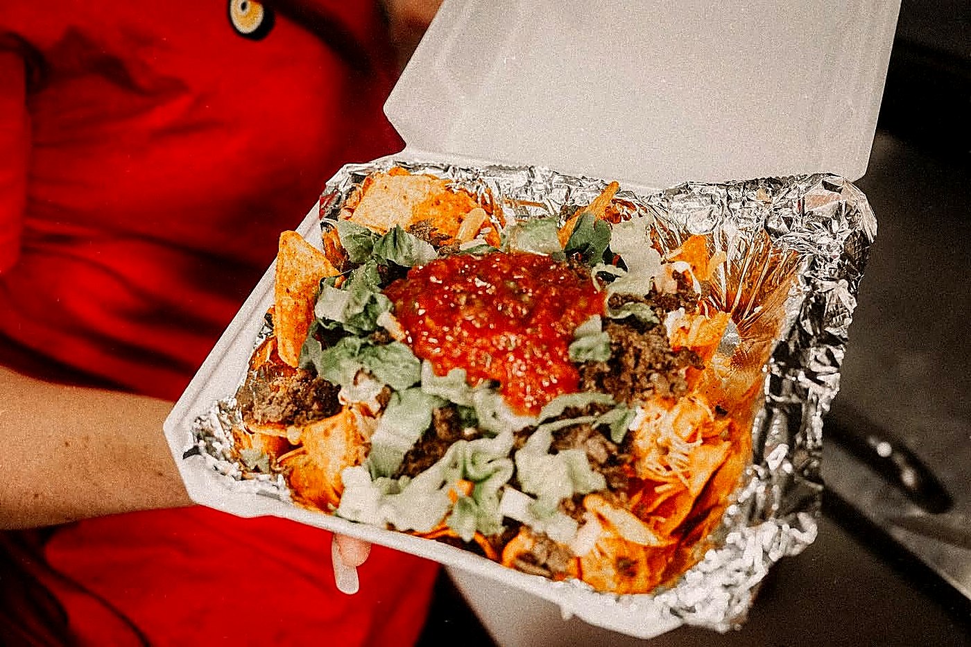 Loaded nachos in a takeaway box