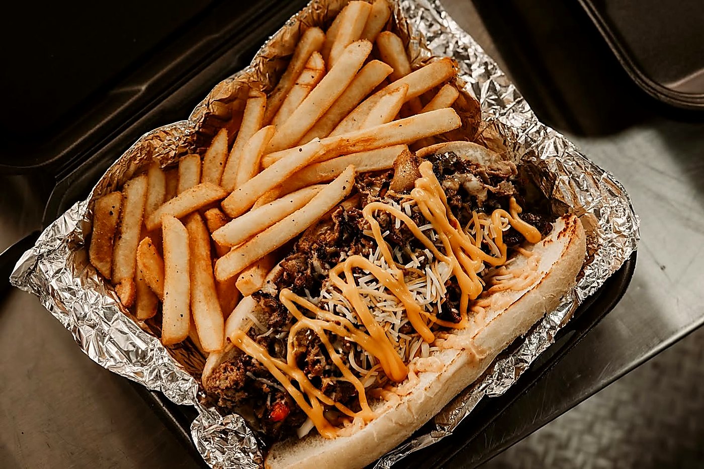Loaded Philly cheesesteak with fries