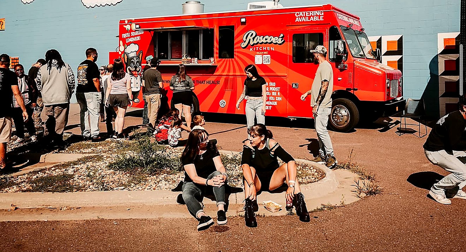 The Roscoe's Kitchen truck serving a crowd